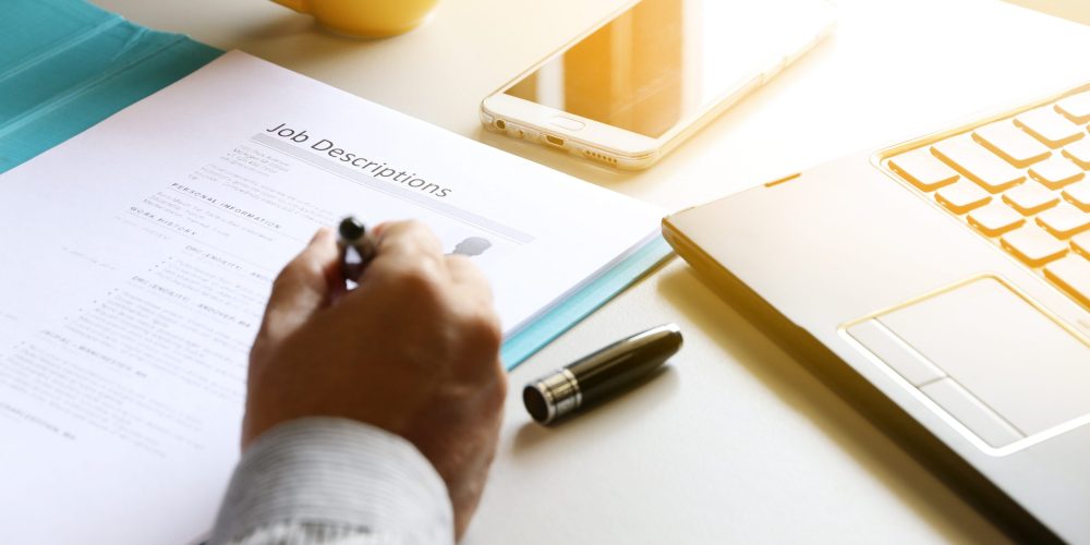 businessman Reading job description paper In office.